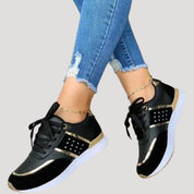 Women stylish metallic accent trainers