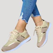 Women stylish metallic accent trainers