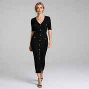 lady in black long midi dress on a plain background