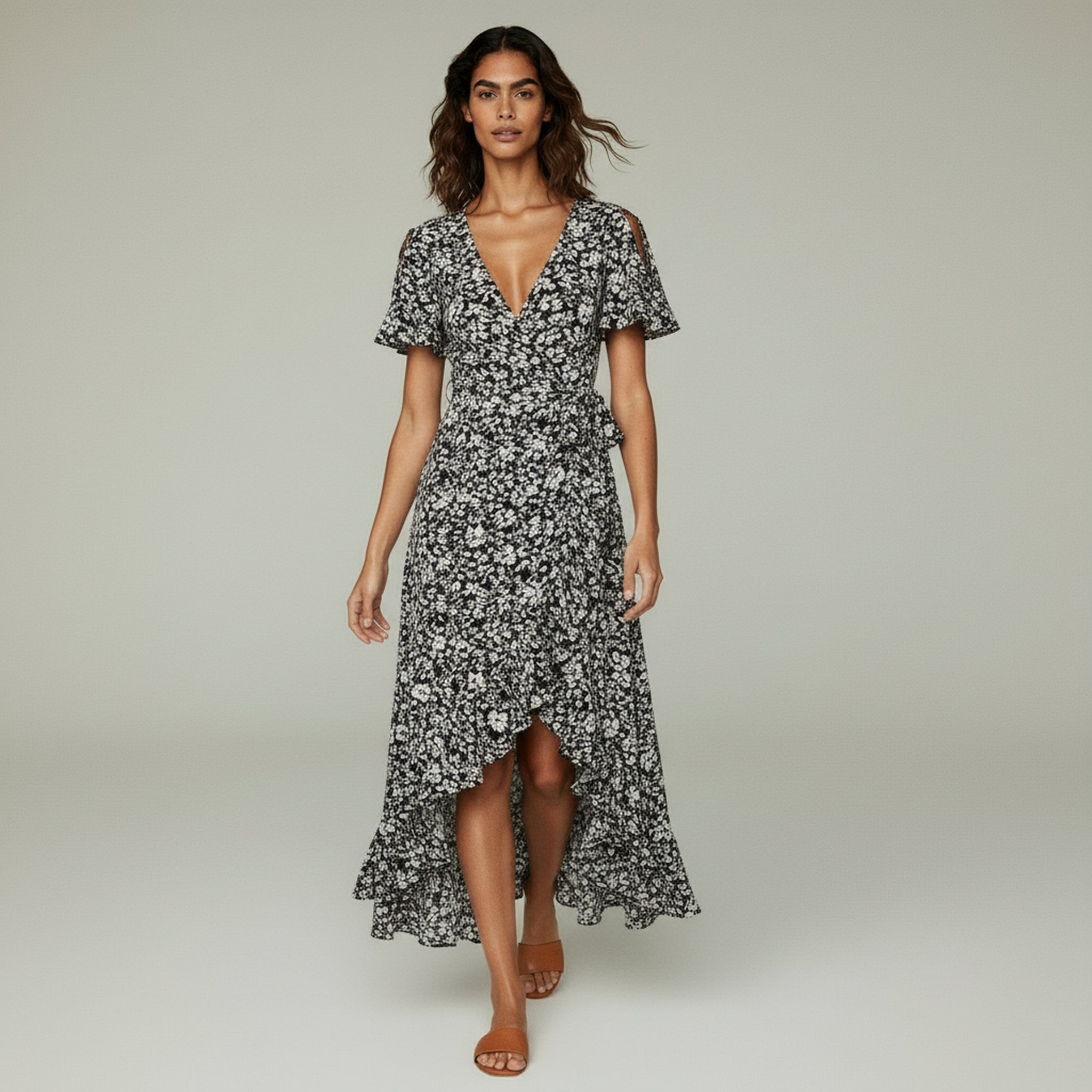 lady in black maxi dress on a plan background