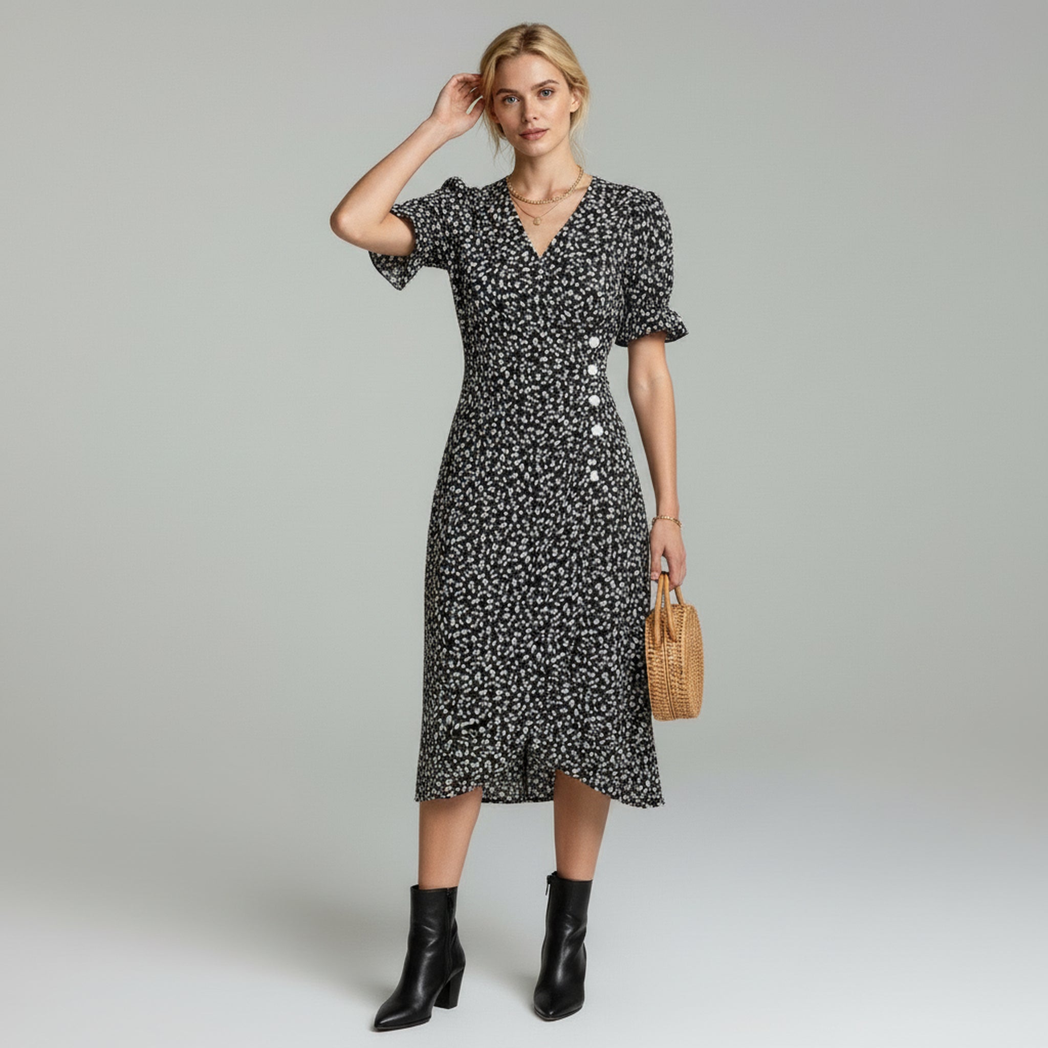 woman wearing Black puff sleeves midi dress paired with black boots on a plain background