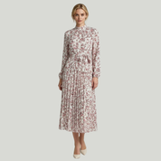 lady in white floral dress on a plain background