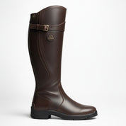 Brown riding boot with a buckle on a white background