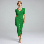 lady in green long midi dress on a plain background