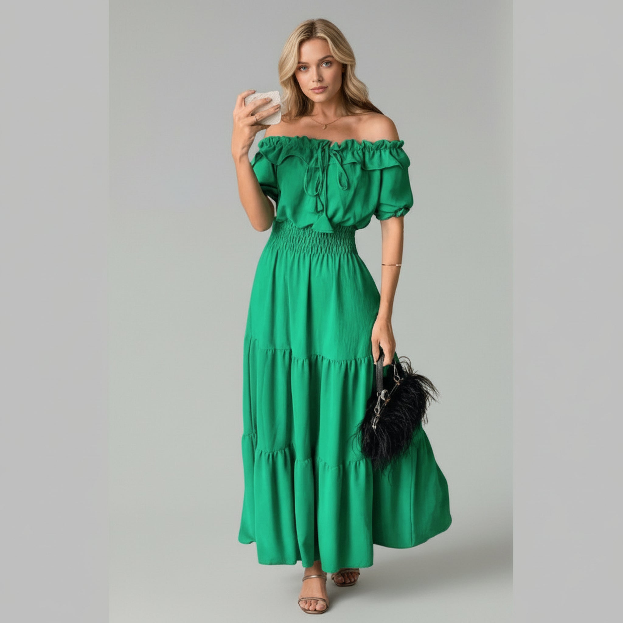 lady in green off-shoulder maxi dress on a plain background