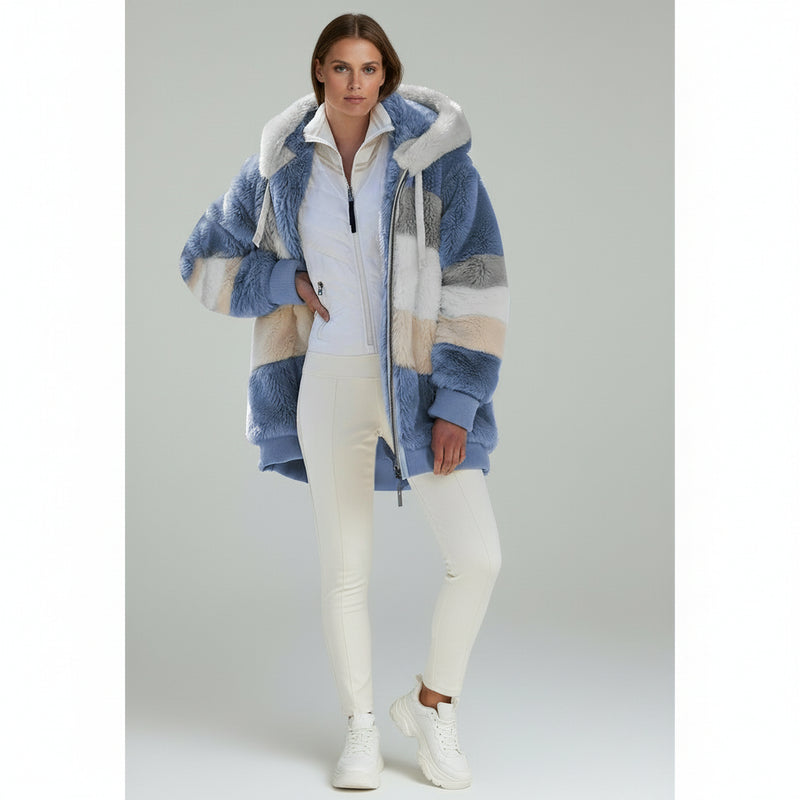 woman wearing white top with Oversized Jacket paired with white pants on a plain background