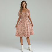 woman wearing pink Flowy maxi dress on a plain background